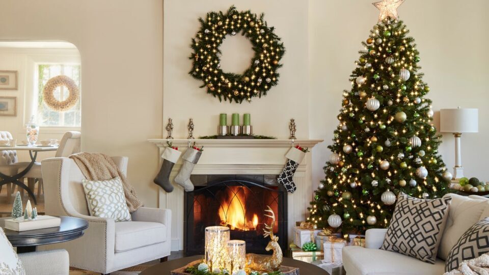 Christmas tree, wreath, stockings and other decorations in an elegant fashion in an upscale home
