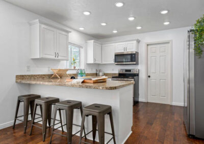 staged kitchen with stools and decor