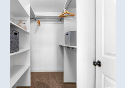 master closet staged with decor