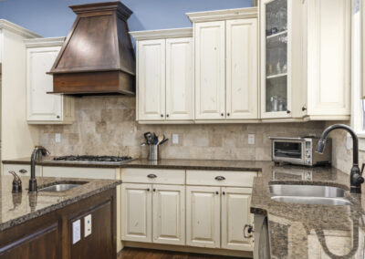 Closed kitchen cupboards on a vacation rental furnishing home showing all the organization