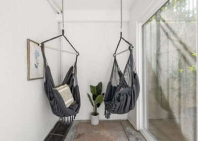 Grey swing chairs in sunroom in Orem UT