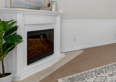 refinished fireplace with white mantel